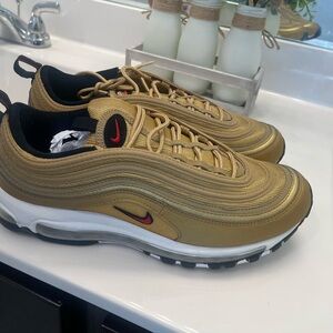 Nike Gold and Black Sneakers with Air Max Cushioning